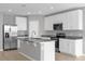 Modern kitchen features stainless steel appliances, granite countertops, and ample cabinet space at 531 Tortugas St, Haines City, FL 33844