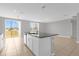 Open-concept kitchen island features a sink, dishwasher, and plenty of room for entertaining at 531 Tortugas St, Haines City, FL 33844