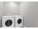 Convenient laundry room features a washing machine and dryer for easy laundry days at 531 Tortugas St, Haines City, FL 33844