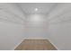 A large walk-in closet with wire shelves for optimal storage in bedroom at 531 Tortugas St, Haines City, FL 33844