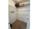 Walk-in closet with wire shelving and carpet floors at 5604 Loma Vista W Dr, Davenport, FL 33896