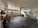Spacious garage providing ample storage, with a large door and utility connections at 5604 Loma Vista W Dr, Davenport, FL 33896
