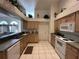 Bright kitchen features tile floors, white appliances, and plenty of cabinet space at 5604 Loma Vista W Dr, Davenport, FL 33896