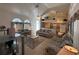 Large living room showcasing tile floors, neutral decor, and an open flow to the kitchen and dining spaces at 5604 Loma Vista W Dr, Davenport, FL 33896