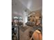 Bright and airy living room with an open layout, tile floors, and plentiful natural light at 5604 Loma Vista W Dr, Davenport, FL 33896