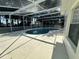 Beautiful kidney-shaped pool inside a screened enclosure at 5604 Loma Vista W Dr, Davenport, FL 33896