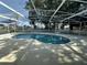 The kidney-shaped private pool is surrounded by a screened enclosure at 5604 Loma Vista W Dr, Davenport, FL 33896