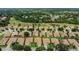 Aerial view of a community surrounded by lush landscaping and a golf course at 578 Newhall Ln, Debary, FL 32713