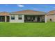 Large backyard with a screened patio, perfect for outdoor entertaining at 578 Newhall Ln, Debary, FL 32713