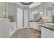 Elegant bathroom features a soaking tub, dual vanities, and granite countertops at 578 Newhall Ln, Debary, FL 32713