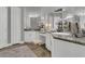 Elegant bathroom with dual vanities, granite countertops and wood-look floors at 578 Newhall Ln, Debary, FL 32713