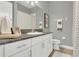 Bright bathroom features a granite countertop, white cabinetry, and stylish decor at 578 Newhall Ln, Debary, FL 32713