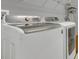 A bright laundry room with modern Samsung washer and dryer appliances at 578 Newhall Ln, Debary, FL 32713