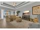 Open floor plan living room boasts hardwood floors, recessed lights, neutral walls, and a view to the lanai at 578 Newhall Ln, Debary, FL 32713