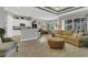 Open floor plan living room and kitchen boasts hardwood floors, recessed lights, neutral walls, and stainless appliances at 578 Newhall Ln, Debary, FL 32713