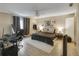 A primary bedroom featuring a ceiling fan, neutral decor, and natural light at 5833 La Costa Dr # S, Orlando, FL 32807