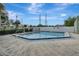 Community pool area with a refreshing pool and clear blue skies at 5833 La Costa Dr # S, Orlando, FL 32807