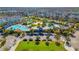 Aerial view of community pools and amenities surrounded by residential homes at 7789 Nemours Pkwy, Orlando, FL 32827