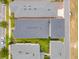 An aerial view of the home showcases its roof, landscaping, and neighborhood at 7789 Nemours Pkwy, Orlando, FL 32827