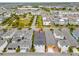 Overhead view of the home, neighboring houses, and proximity to a park at 7789 Nemours Pkwy, Orlando, FL 32827