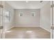 Well-lit bedroom featuring light wood floors and neutral paint, creating a calming and inviting atmosphere at 7789 Nemours Pkwy, Orlando, FL 32827