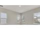 Bright bedroom with ample natural light and large windows at 7789 Nemours Pkwy, Orlando, FL 32827
