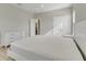 Bedroom boasts neutral walls, light floors, white furniture, and an open closet at 7789 Nemours Pkwy, Orlando, FL 32827