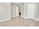 A spacious bedroom with light wood flooring and neutral walls, providing a blank canvas for personalization at 7789 Nemours Pkwy, Orlando, FL 32827