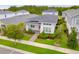 Well-manicured home surrounded by mature trees and landscaping at 7789 Nemours Pkwy, Orlando, FL 32827