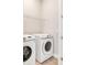 Laundry room with front-loading washer and dryer at 7789 Nemours Pkwy, Orlando, FL 32827