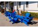 Stylish outdoor seating with bright blue furniture, perfect for relaxing and enjoying the weather at 7789 Nemours Pkwy, Orlando, FL 32827