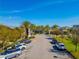 Commercial center parking lot with palm trees, landscaping, and storefronts at 7789 Nemours Pkwy, Orlando, FL 32827