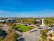 Commercial center parking lot with grassy common area, dining and retail at 7789 Nemours Pkwy, Orlando, FL 32827