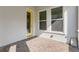 Exterior patio with brick pavers and a yellow accent door at 7789 Nemours Pkwy, Orlando, FL 32827