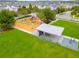 Community playground with a play structure, covered picnic tables, and green spaces at 7789 Nemours Pkwy, Orlando, FL 32827