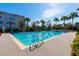 A large lap pool with lane markers offers a refreshing outdoor workout space at 7789 Nemours Pkwy, Orlando, FL 32827