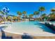 Bright, sunny pool with splash fountain and palm trees, perfect for Gathering fun at 7789 Nemours Pkwy, Orlando, FL 32827