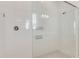 Modern shower with glass enclosure and white subway tile at 7789 Nemours Pkwy, Orlando, FL 32827
