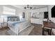 Cozy bedroom with bed, kitchenette, and ample natural light at 7813 Delphia St, Orlando, FL 32807