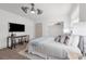 Bright bedroom featuring a television, ceiling fan, and closet at 7813 Delphia St, Orlando, FL 32807