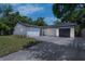 Single Gathering home with a brick exterior, mature trees, and a well-manicured lawn at 7813 Delphia St, Orlando, FL 32807
