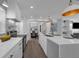Contemporary kitchen with a large island, modern appliances, and an open layout to the dining area at 7813 Delphia St, Orlando, FL 32807