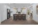 Stylish kitchen island with seating, pendant lighting, and stainless steel appliances creates a inviting place to eat at 7813 Delphia St, Orlando, FL 32807