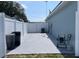A fenced in backyard features concrete, ideal for outdoor living and entertaining at 8187 Sw 60Th Ter, Ocala, FL 34476