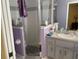 Well-lit bathroom features a glass shower, vanity with ample storage, and modern fixtures at 8187 Sw 60Th Ter, Ocala, FL 34476