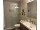 Modern bathroom with a sleek glass-enclosed shower, designer tile work, and contemporary fixtures at 8187 Sw 60Th Ter, Ocala, FL 34476