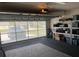 Garage with transparent door offers views of the neighborhood and convenient access at 8187 Sw 60Th Ter, Ocala, FL 34476