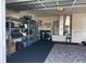 Tidy garage with washer, dryer, shelving, and ample space for storage and functionality at 8187 Sw 60Th Ter, Ocala, FL 34476