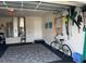 Spacious garage with a bicycle, wall-mounted storage, and a clean, organized layout at 8187 Sw 60Th Ter, Ocala, FL 34476
