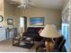 Comfortable living room featuring a ceiling fan, neutral paint, and a cozy seating area at 8187 Sw 60Th Ter, Ocala, FL 34476